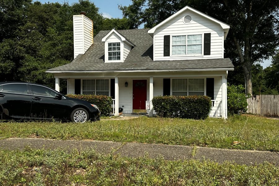 Before renovation — two-story home